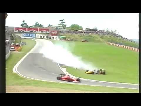 1990 F1 San Marino GP - Nigel Mansell (Ferrari) avoid contact with Paolo Barilla (Minardi)