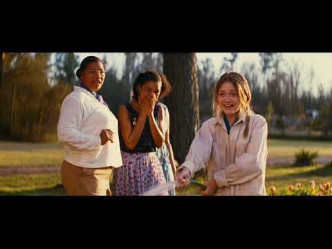 Trailer frame: Lily and Rosaleen on a dusty Carolina road, late-afternoon sun, gentle guitar score rising