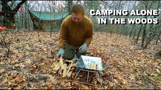 Camping Alone In Woods With Snow And Portable Fire Pit