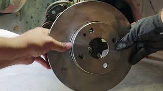 2002 Ford Escort brake rotors and pad replacement.