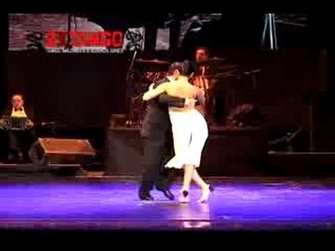  Miguel Angel Zotto  and  Daiana Guspero  are  dancing  to  the  tango  "  Tierra Querida  "