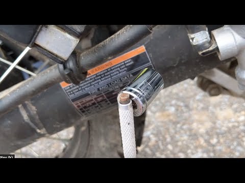 Remove a 12 mm socket from a KLR swing arm