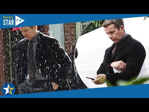 The Midwich Cuckoos: Suit-clad Max Beesley is soaked with rain as he's seen on-set of Sky adaptation