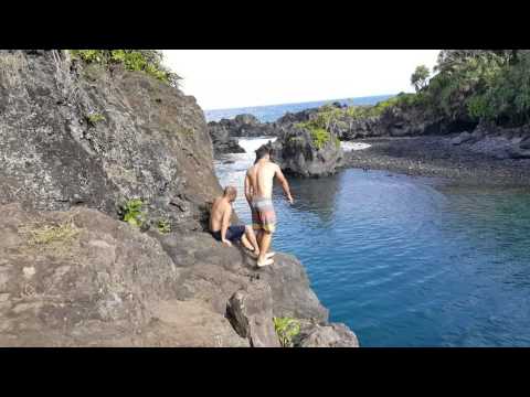 Cliff diving off of Venus pool on road to hana
