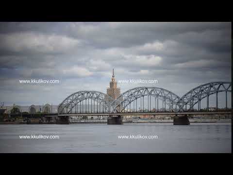 View through the Daugava River of the Riga railway bridge and the Building of Academy of Sciences of