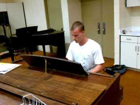 Pianist Adam Kirk playing his own piece titled 