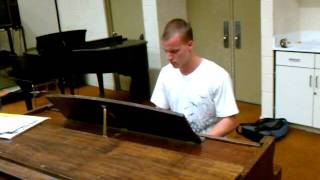 Pianist Adam Kirk playing his own piece titled 