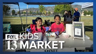 Young business owners showcase their products and goods at all kids market