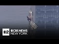 2 People Climb The Empire State Building In NYC Wave Banner