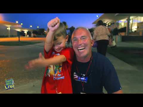 Promo montage: confetti, giant storybook screen, and Super Readers leading a clap-along