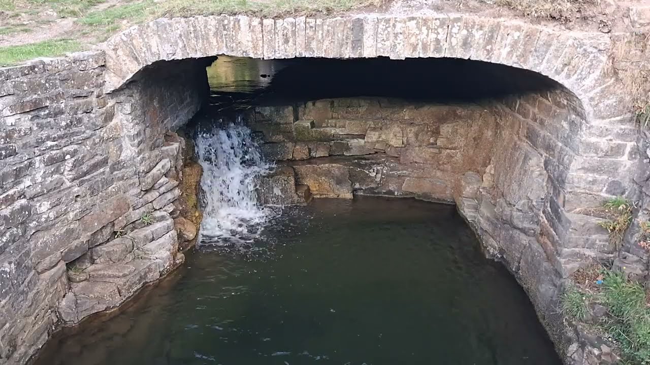 Underground waterfall beneath the flat arch of Middlehope Burn at Low Slit Mine, Slit Woods, Westgate, Weardale, County Durham.  
