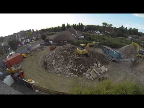 dji 550 with apm 2.5 flying over a building site