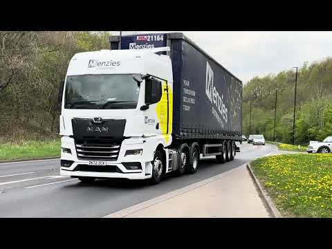 Menzies MAN  DK72 ZCX heads up Cowley Hill with a Menzies Distribution Trailer