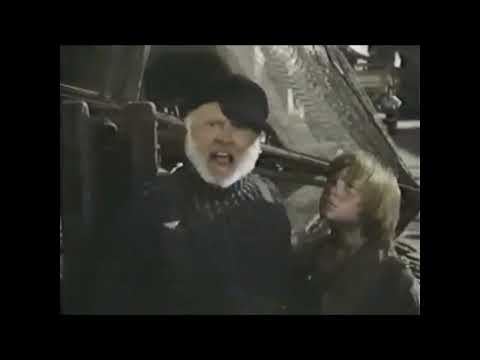 Trailer close-up: Nora (Helen Reddy) framed by lantern light during 'Candle on the Water'; critics often single out the ballad