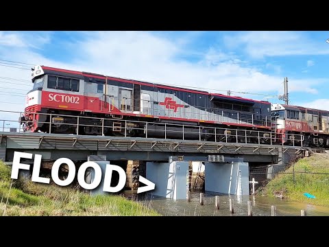 LONG FREIGHT TRAIN PASSING OVER A FLOOD!!!