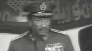 Sadat speaking with Ahmed Badawi, commander of the Third Army, about the siege and resistance of ...