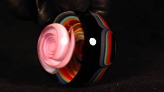 Pink spiral over rainbow and fume spiral