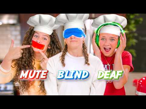 Three kids in chef hats pose in a kitchen; left points to a red 'MUTE' sticker over her mouth, middle wears a blue blindfold, right has green headphones with 'DEAF' text nearby.