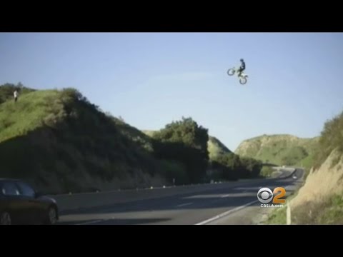 Dangerous Stunt - Video Shows Man On Dirt Bike Flying Over Freeway In Moreno Valley