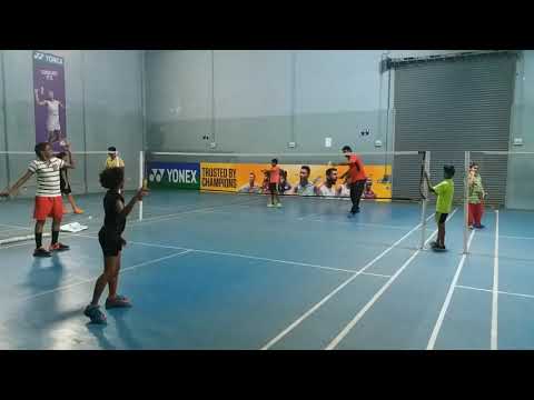 Badminton training in half court by Indian coach