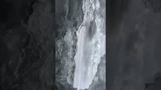 Ice Climbing The Inside Of A Frozen Waterfall