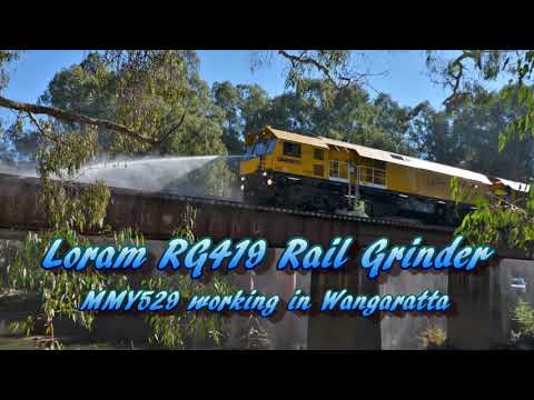 In Focus #01 - Loram Rail Grinder at work including bridge hose down.