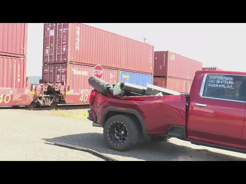 Pickup truck with trailer hit by train in Northeast Portland; no one injured