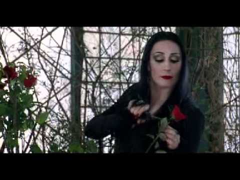 Addams Family-Morticia cuts heads off roses