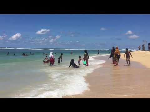 Muslim Women Enjoying the Ocean at Matara Beach in Sri Lanka