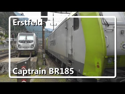Dual Captrain BR185 departs from Erstfeld station with long freight train!