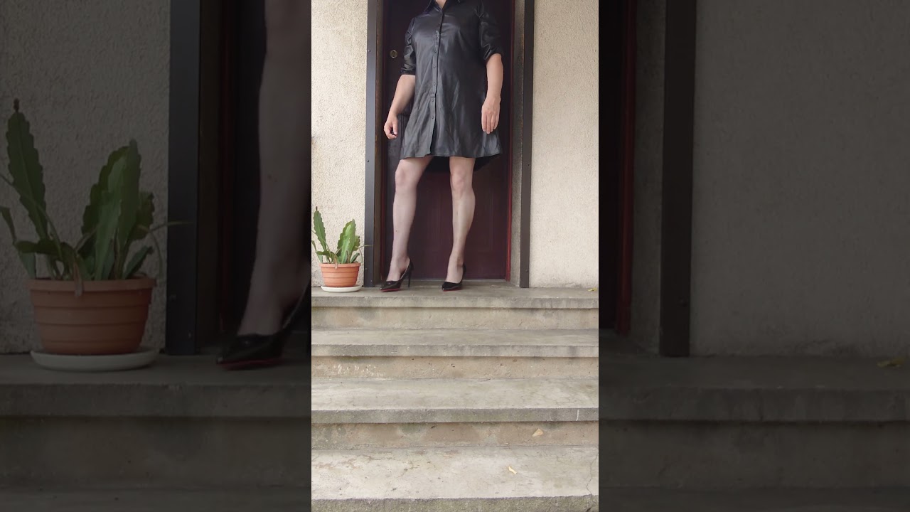 On the stairs in black