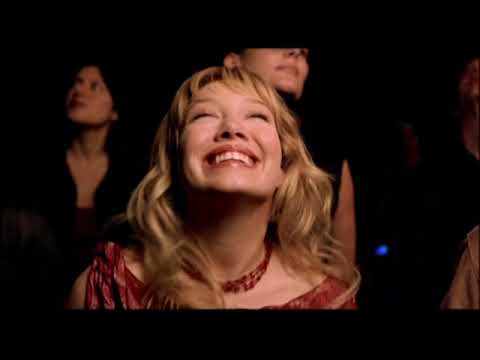 Trailer montage: Trevi Fountain, scooters, red-carpet flashbulbs before the concert