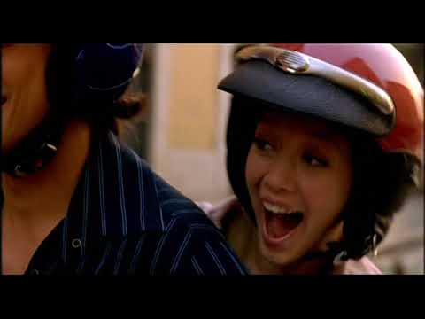 Trailer still: Vespa zip through Roman streets while a bubblegum-pop chorus kicks in