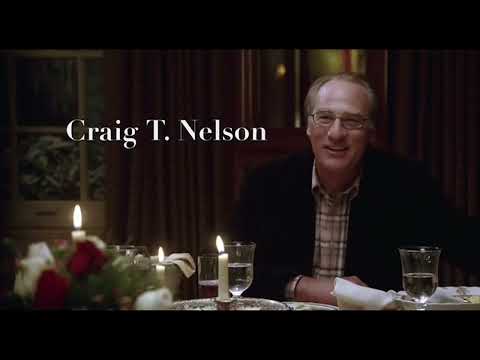 Trailer still — bar lights and jukebox glow, foreshadowing the Nightingale dance beat