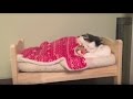 Cat Puts Herself to Sleep in Tiny Human Bed