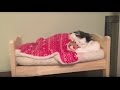 Cat Puts Herself To Sleep In Tiny Human Bed