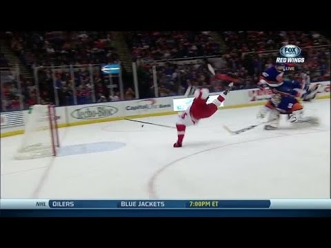 Darren Helm flips over Poulin and scores
