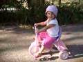 Lilah Pedaling Her Tricycle