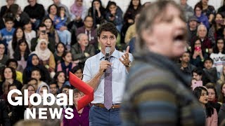 Trudeau gets heated as hecklers interrupt his talk on climate change