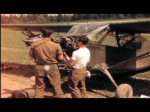U.S. Army aircraft mechanics repair a Stinson L-5 airplane in Germany HD Stock Footage