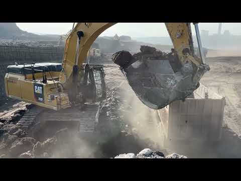 Caterpillar 352F Excavator Loading Mercedes And MAN Trucks