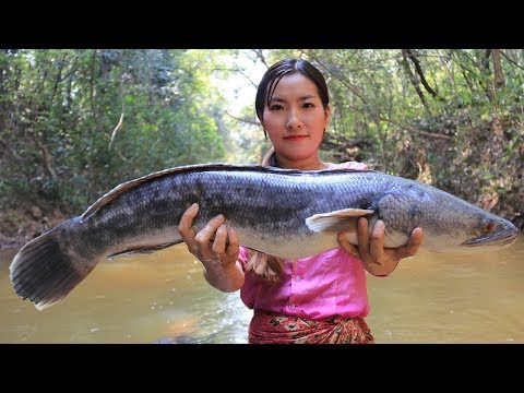 Cooking Big Fish Sour Soup With Banana Flower In Forest