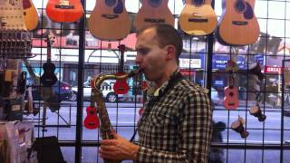 A customer trying out a Ted Klum Acoustimer Resotone