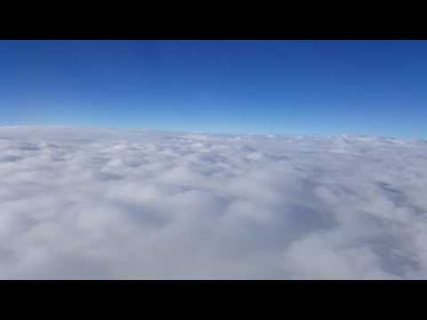 Flying over the clouds - Beautiful airplane window view