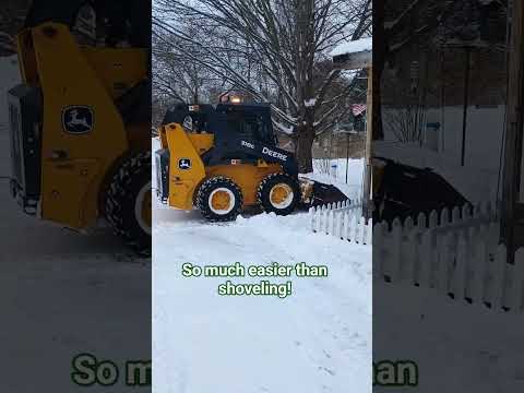 So much easier than shoveling! John Deere skidsteer