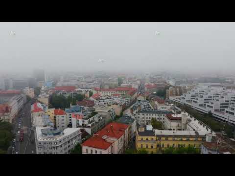 Aerial perspective of Brno, Czech Republic, enveloped in a layer of fog, showcasing a blend of