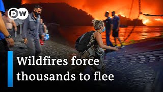 Greece: Residents flee as wildfires approach | DW News