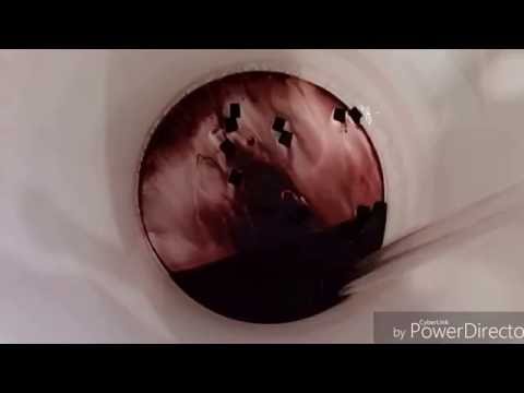 Racking the wine for the fourth time still not clear enough to bottle