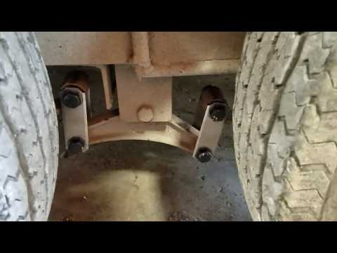Trailer axle suspension Equalizer Shackle straps flipped upside down.