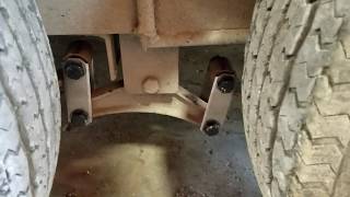 Trailer axle suspension Equalizer Shackle straps flipped upside down.